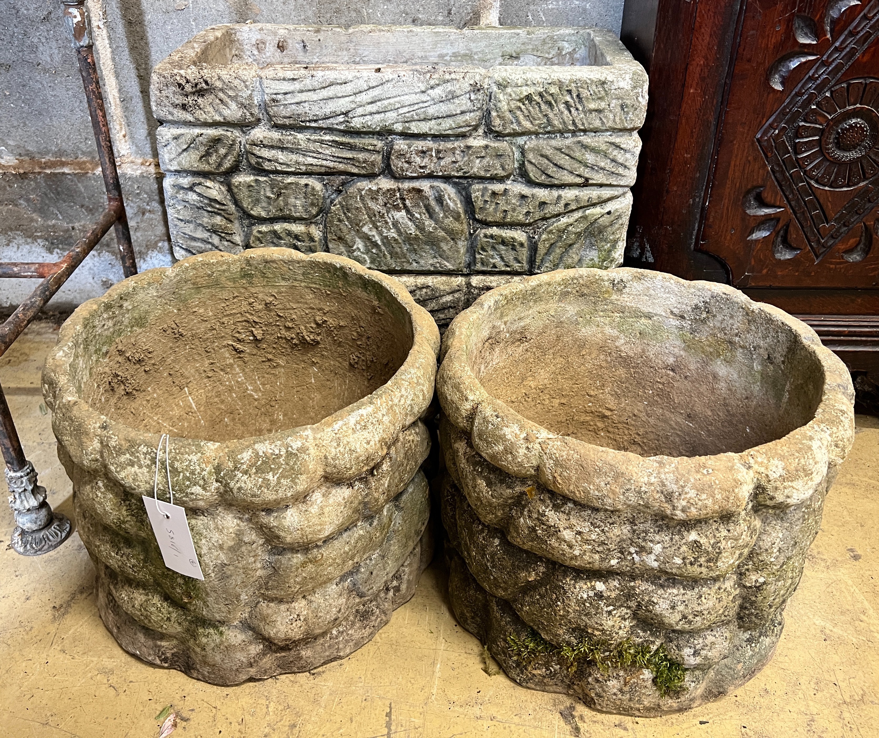 A pair of circular reconstituted stone garden planters, diameter 31cm, height 25cm together with a pair of rectangular planters